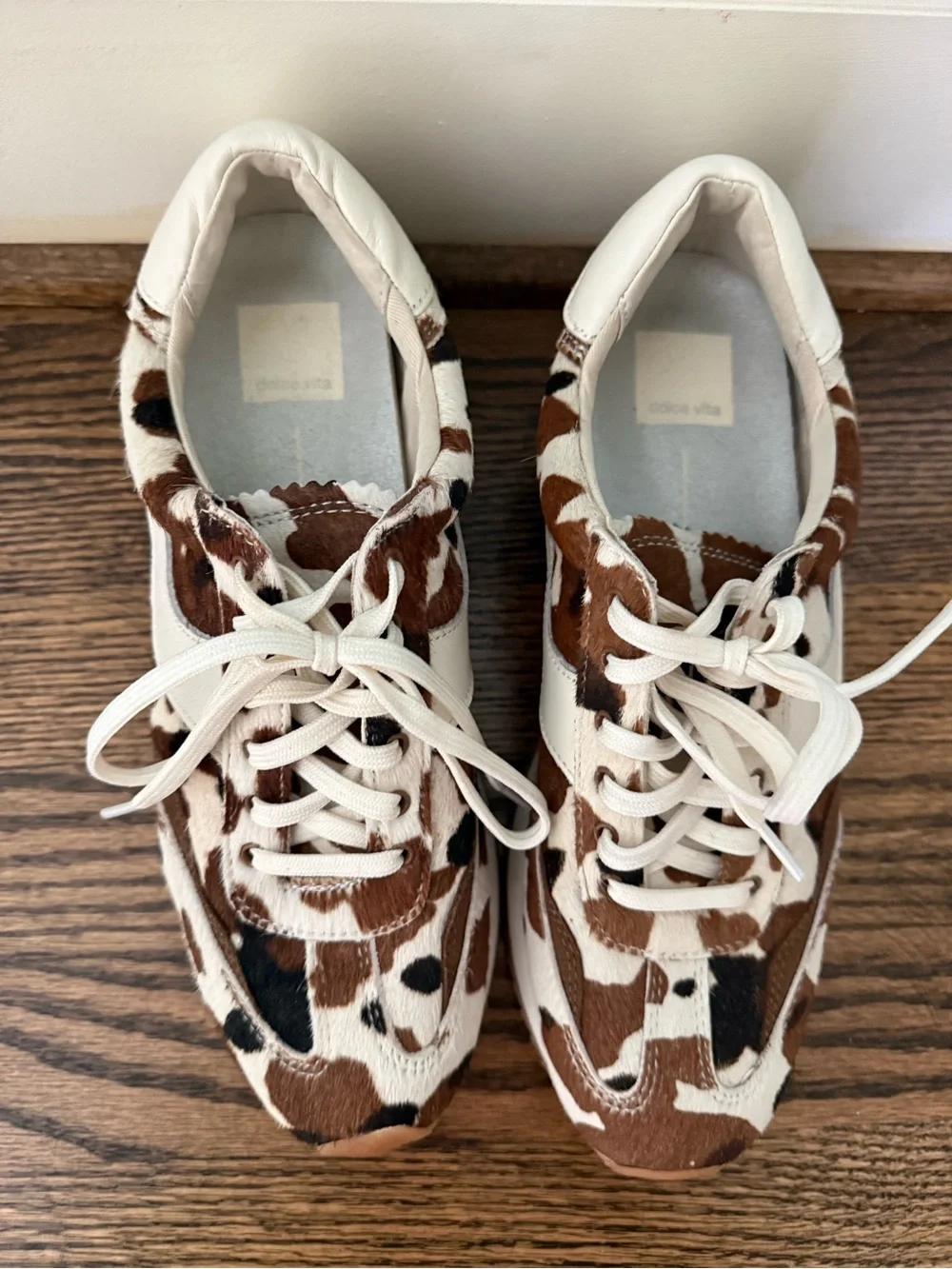 Dolce Vita Cow-Print Leather Sneakers in White & Brown